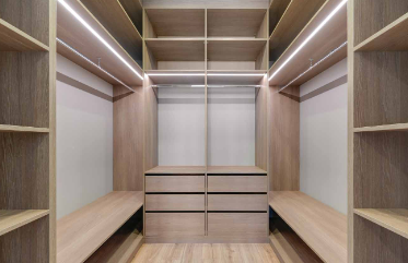 Custom walk-in closet with professional lighting and organization